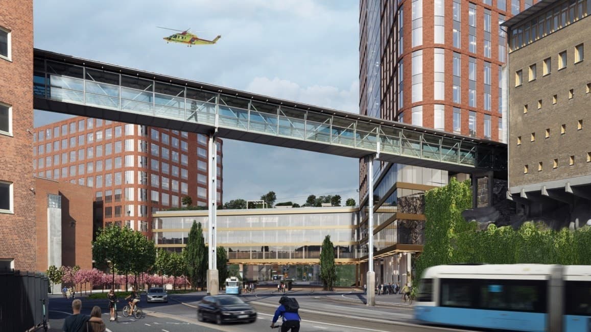 Tre hus och en gångbro som förbinder två av husen. Spårvagn framför och helikopter i luften.